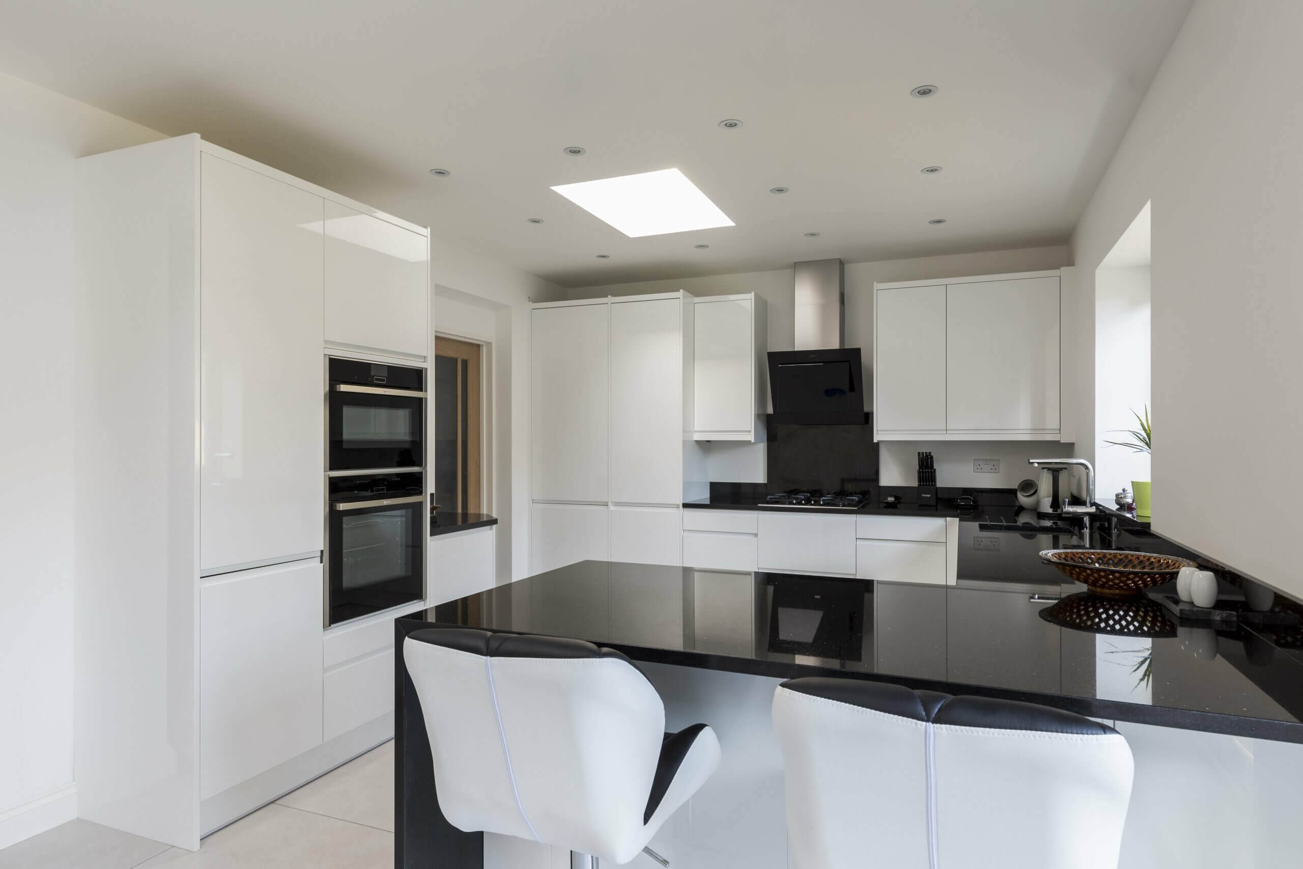 Black Granite Worktop On White Kitchen Units